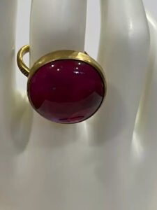 a ring with a red stone